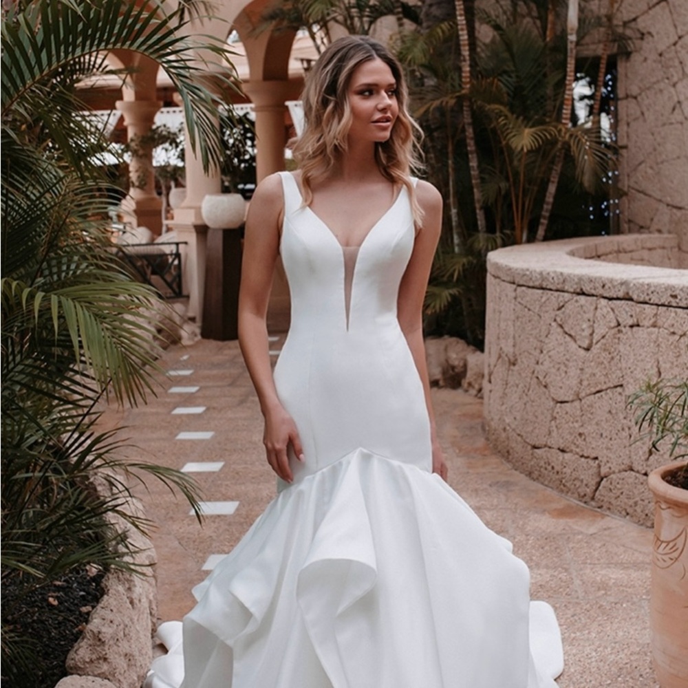 Abella White Gown with Sleeveless Design and Plunge Neckline for Bride